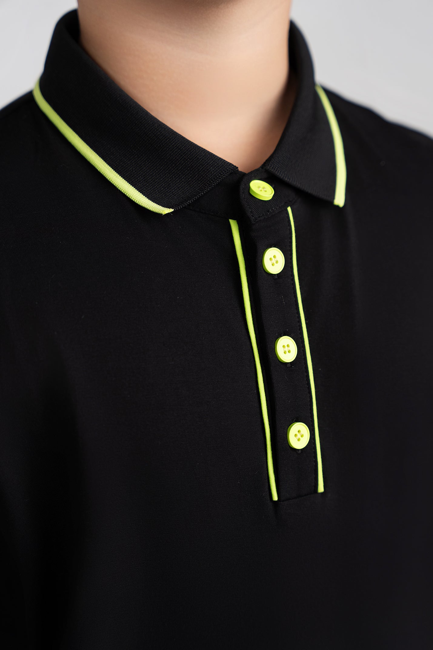 black and yellow flash polo husky boys detail