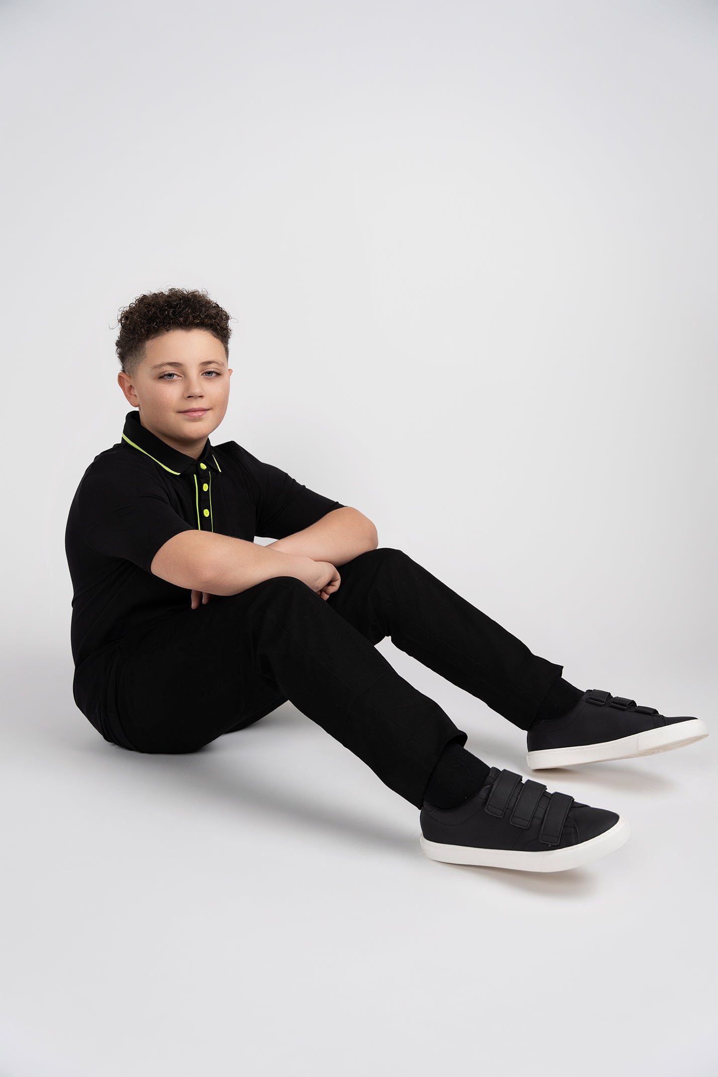 black and yellow flash polo husky boys sitting